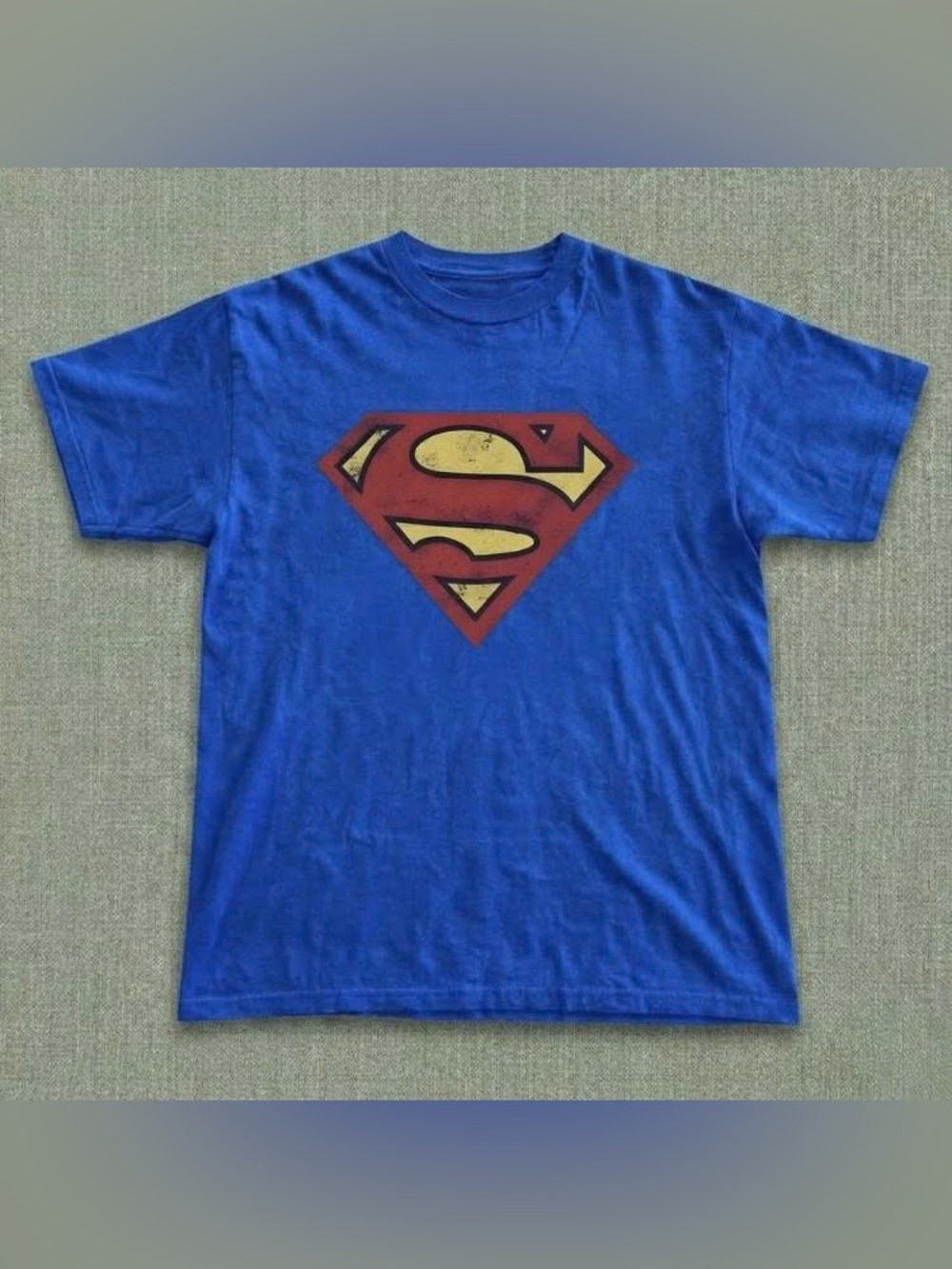 Vintage Blue Tee with Red and Yellow Superhero Emblem